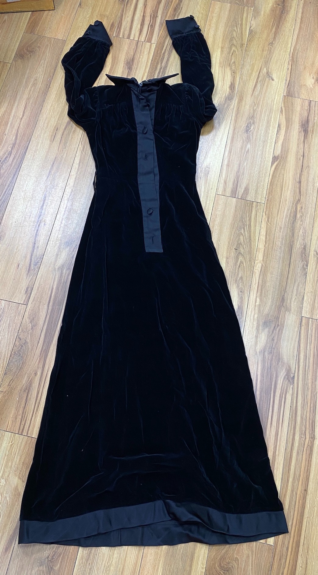 A blue 1950s ballgown, together with a Jean Varon black velvet button up dress